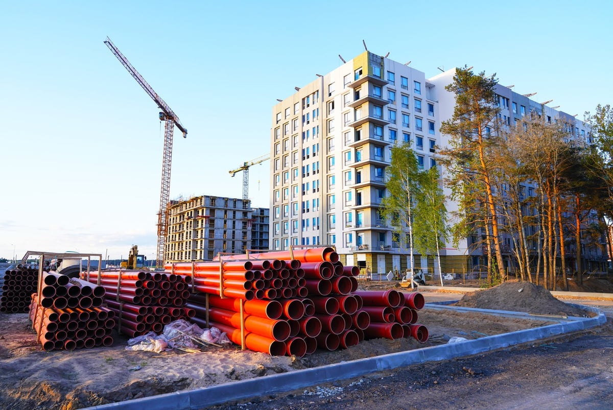 Construction site with crane and residential building