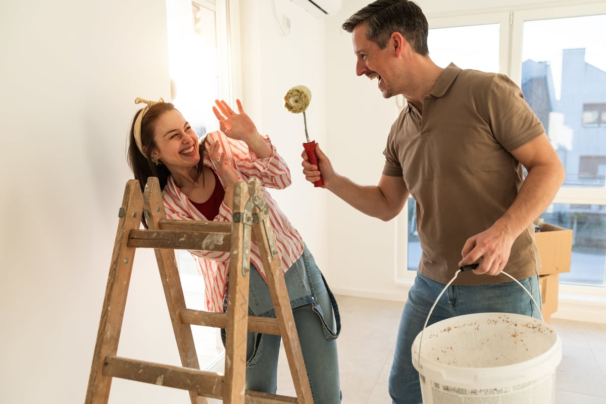 Couple painting and renovating their home together